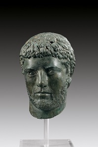 Lot 6a: Severan male portrait. Roman Imperial times, early 3rd century AD. Hollow bronze cast, H. 28 cm. Superb dark-green patina, broken at the neck, most of the face missing. From the stock of Ancient and Medieval Art, Furneux, Pelham, which closed down in 1990. Gorny & Mosch 210 (2012), 13A. Estimate: 30,000,- euros. Hammer price: 60,000,- euros.