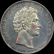The obverses of two counterfeit 1825 Bavaria Coronation Thalers.