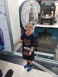 Henry McArthur was the winner of this year’s raffle and minted the first coin in 2018.