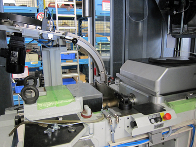 Blank supply for a horizontal coin minting machine. Photograph: UK.