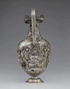 Pitcher with Scenes from the Trojan War of Achilles with Eight Greek Warriors. Weeping over the Body of Patroclus and Priam’s Embassy to Ransom Hector?s Body; Episodes from the Life of Achilles. Roman, 1-100 CE. Inscription: MERCVRIO AVGVSTO Q DOMITIVS TVTVS EX VOTO (To Augustan Mercury, Quintus Domitius Tutus in fulfillment of a vow). Find-spot: Berthouville, France. Silver and gold. H. 29.9 cm; W. 14.5; Circumference. 42 cm. Bibliothèque nationale de France, Paris: inv. 56.4. Photo: Tahnee Cracchiola © Getty-BnF.