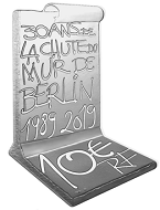 This commemorative coin marking the Fall of the Berlin Wall is struck in a special shape.